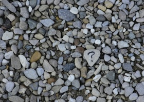Question mark on pebbles
